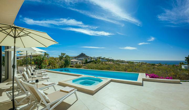 Pool and Jacuzzi at Casa Alba with desert hills and the sea in the distance