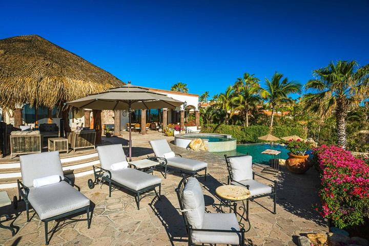 Pool terrace with palapa, umbrellas and bougainvillea at Casa Alegria