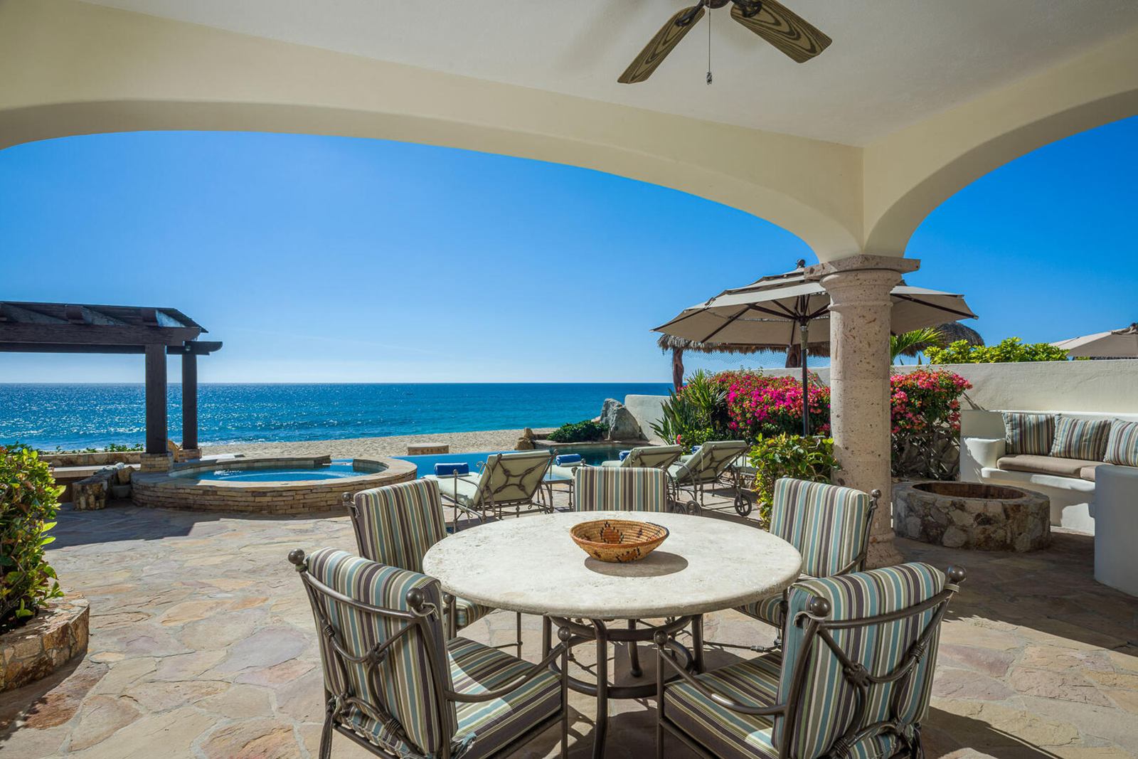 Outdoor dining table on an ocean-view terrace in San José del Cabo