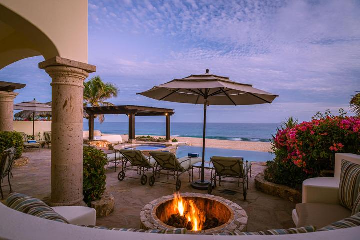 Fire pit burning at twilight on the terrace at Casa Cielo