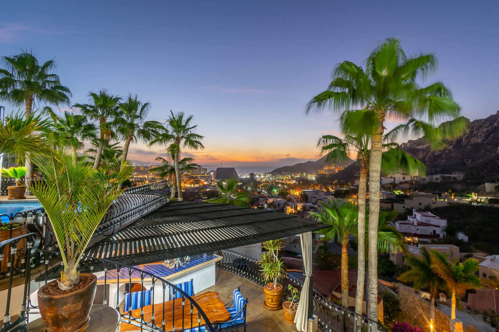 Evening view from a Pedregal villa over the hillside toward the lights of Cabo San Lucas