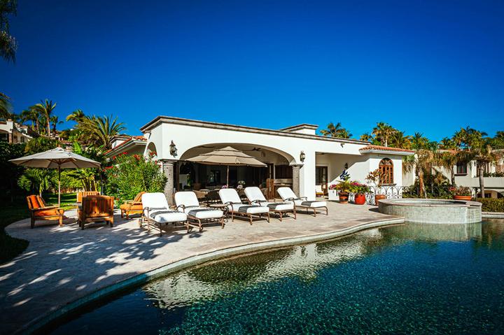 White villa facade and pool terrace at Casa de las Risas
