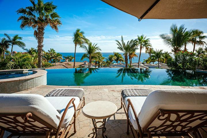 Infinity pool edge with palms and the Sea of Cortez at Casa de las Risas