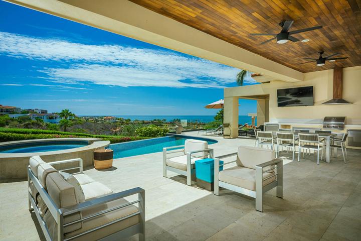 Covered terrace lounge looking over the pool at Casa Isabelle