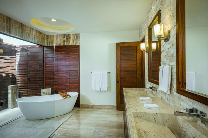 Bathroom with freestanding tub and stone vanity at Casa Isabelle