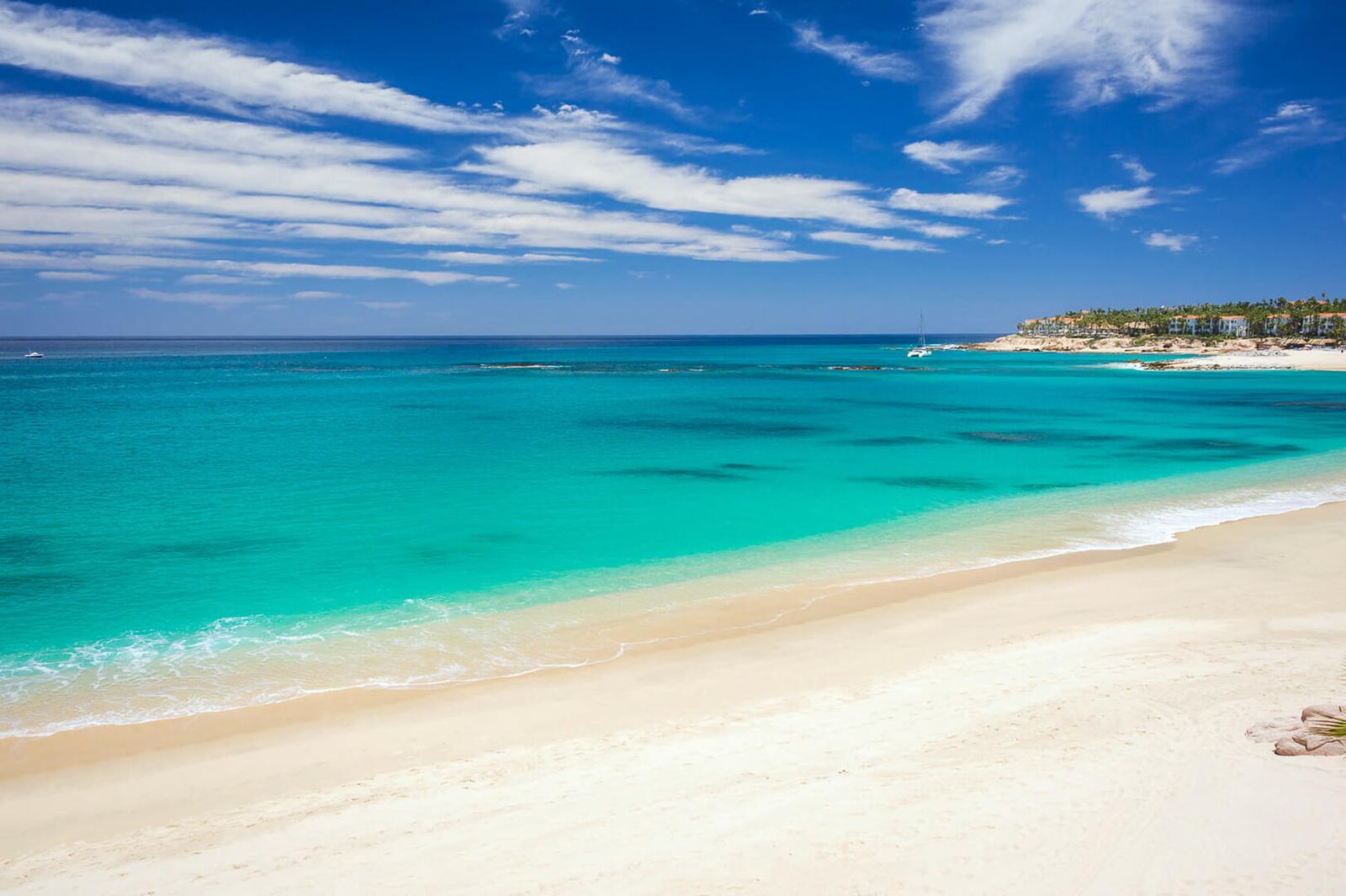 Turquoise water and soft sand along Palmilla Bay