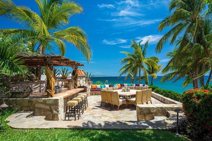 Outdoor bar and dining area with ocean views at Casa Koll Estate