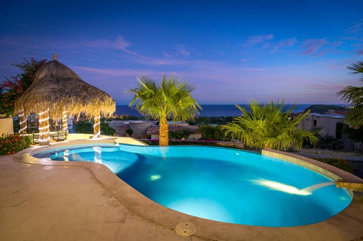 Pool and palapa at dusk at Villa Buena Vida