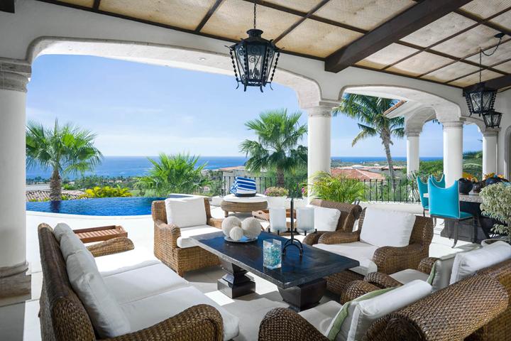 Covered terrace lounge overlooking the ocean at Villa Buena Vida